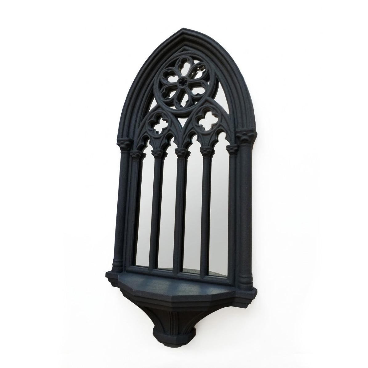 Angled view of gothic mirror shelf with cathedral window design
