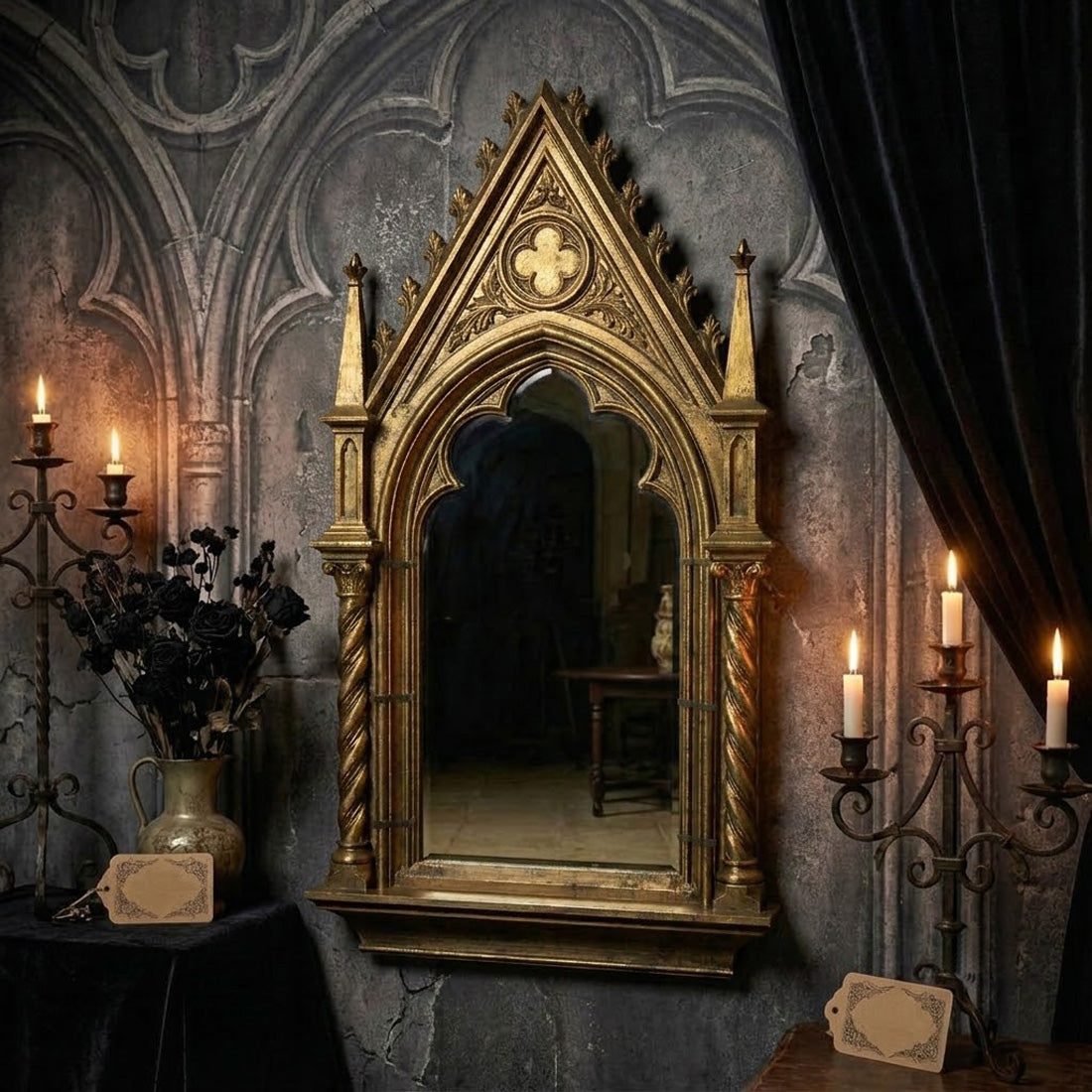Antique gold cathedral arch mirror displayed with candles and Gothic decor