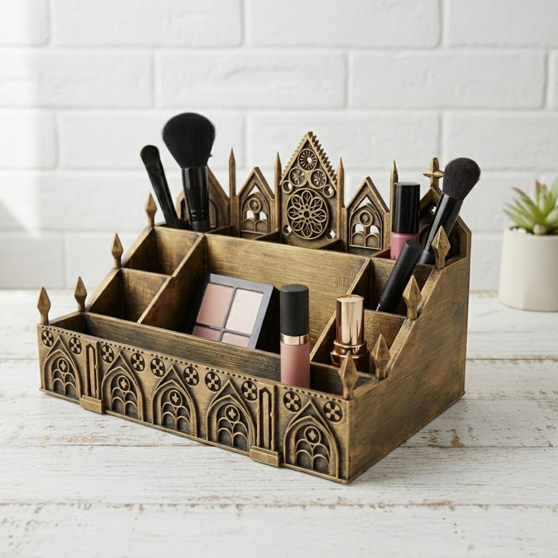 Antique gold Gothic makeup organizer filled with brushes, cosmetics, and palettes